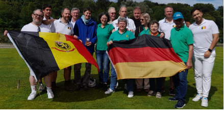A group
            of people holding flags
            Description automatically generated